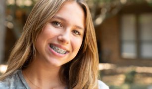 Cramer orthodontic patient smiling braces